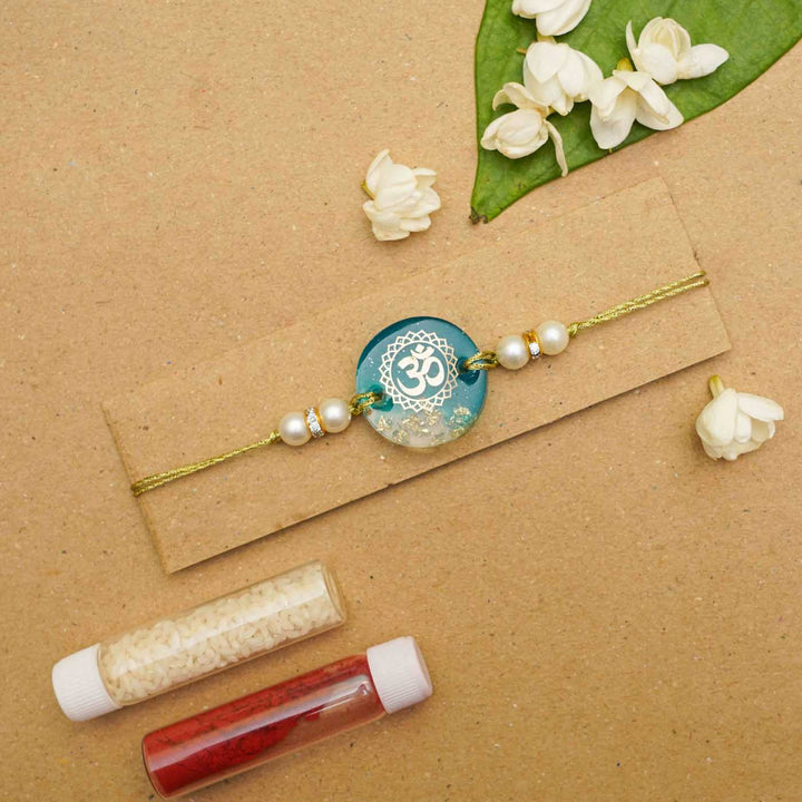 Handmade Resin Round Om Preserved Flower Rakhi With Roli Chawal