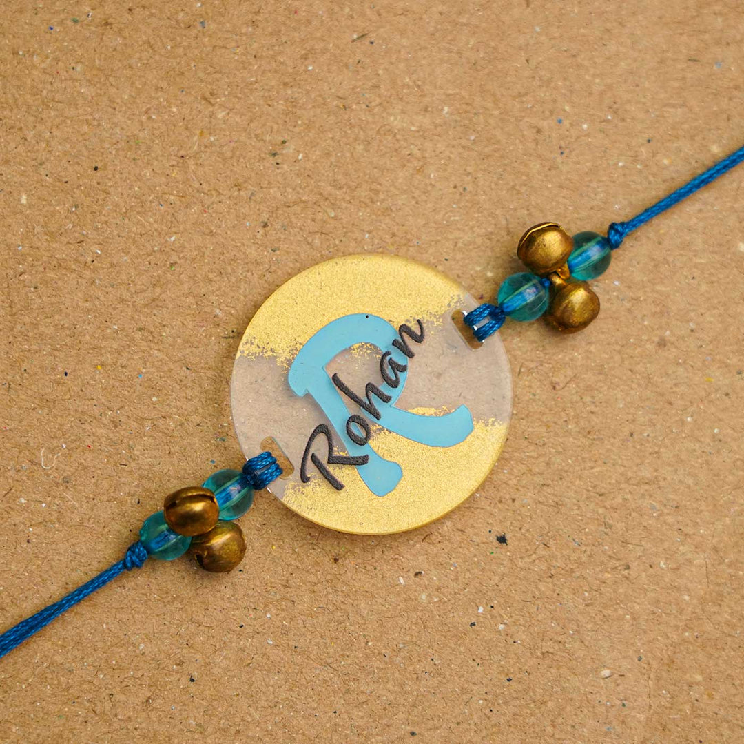 Personalized Handmade Name Golden Acrylic Rakhi With Roli Chawal