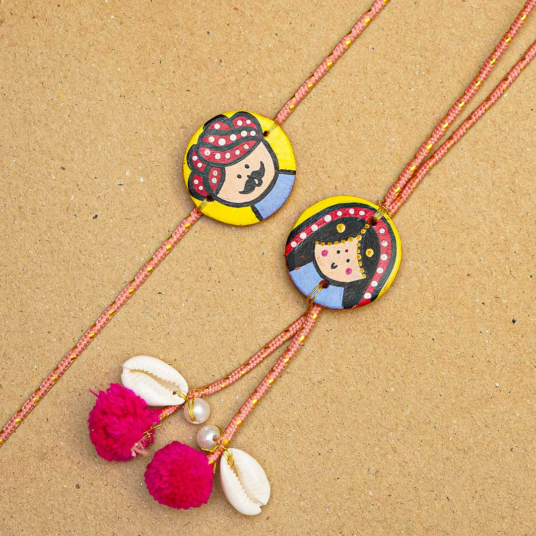 Handcrafted Raja-Rani Terracotta Rakhi With Roli Chawal