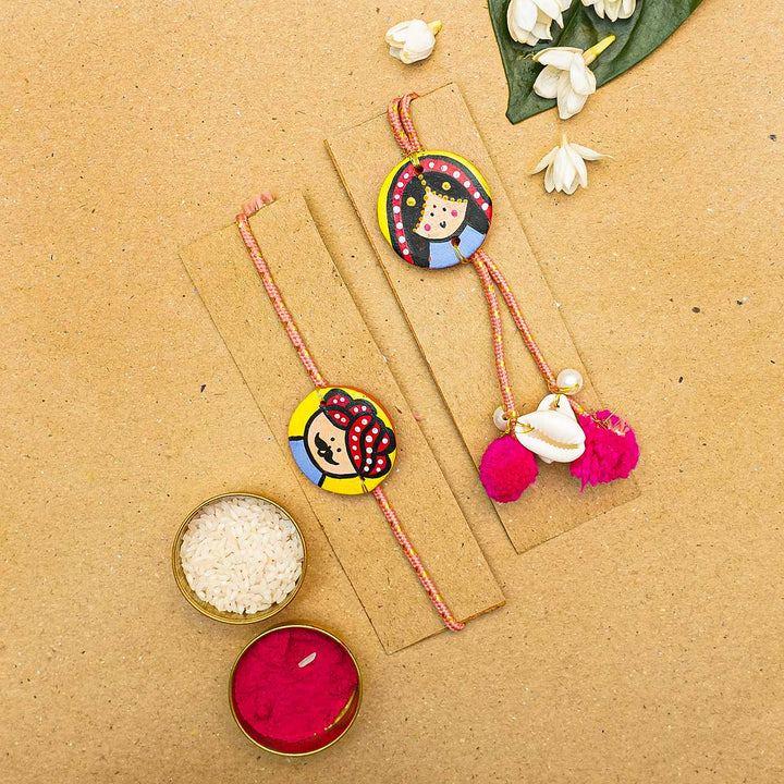 Handcrafted Raja-Rani Terracotta Rakhi With Roli Chawal