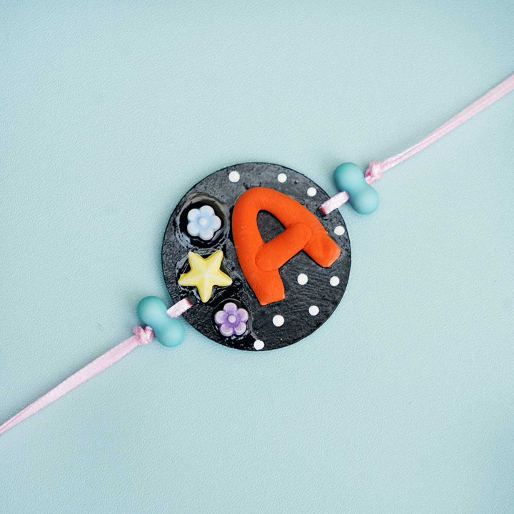 Personalized Hand-painted Alphabet Rakhi With Roli Chawal