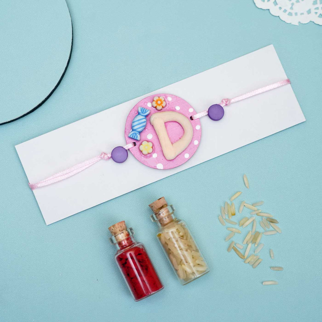 Personalized Hand-painted Alphabet Rakhi With Roli Chawal