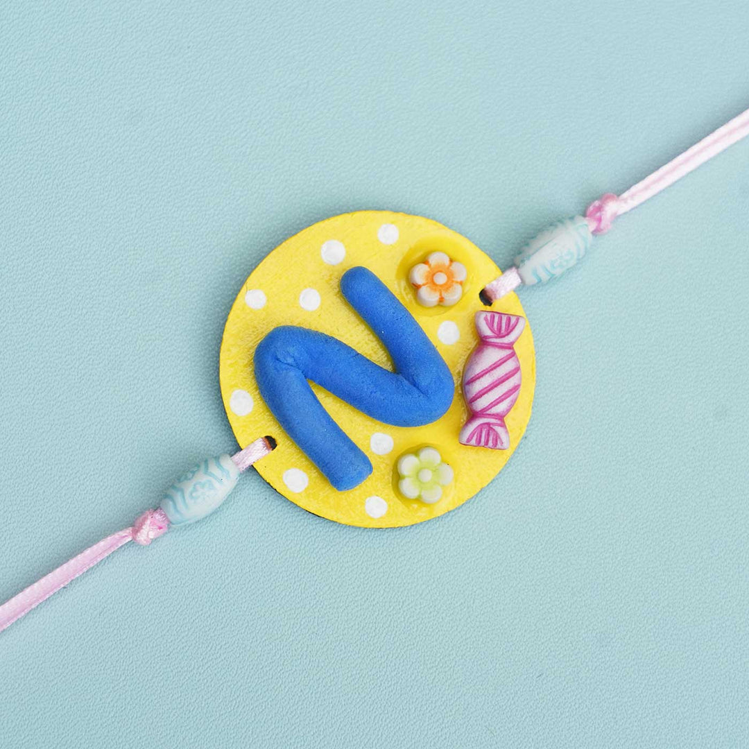 Personalized Hand-painted Alphabet Rakhi With Roli Chawal