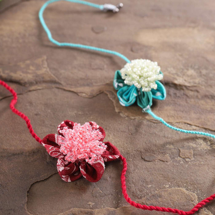 Handmade Beaded Floral Moti Rakhi With Roli Chawal | Set of 2