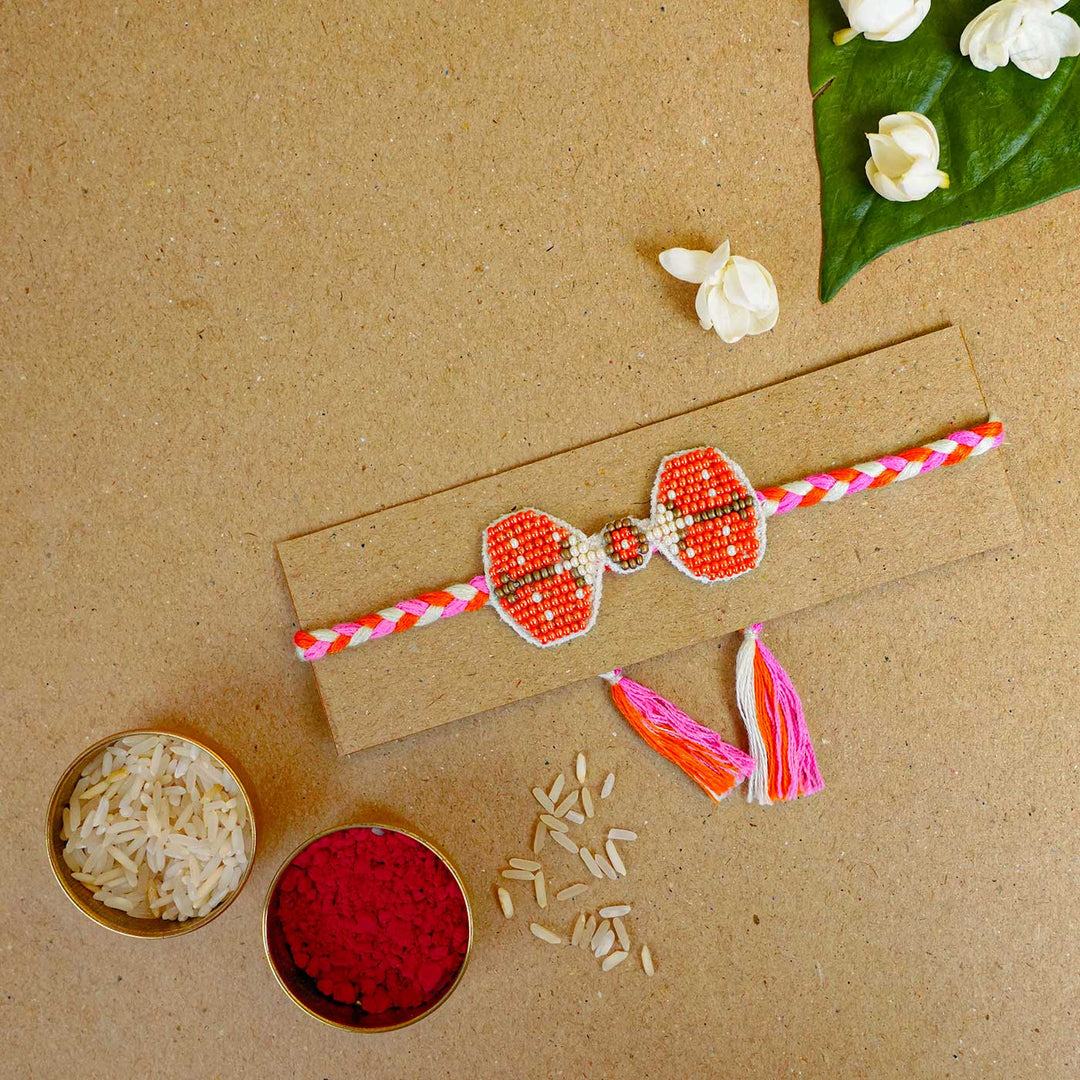 Reusable Beaded Orange Bug Rakhi With Roli Chawal