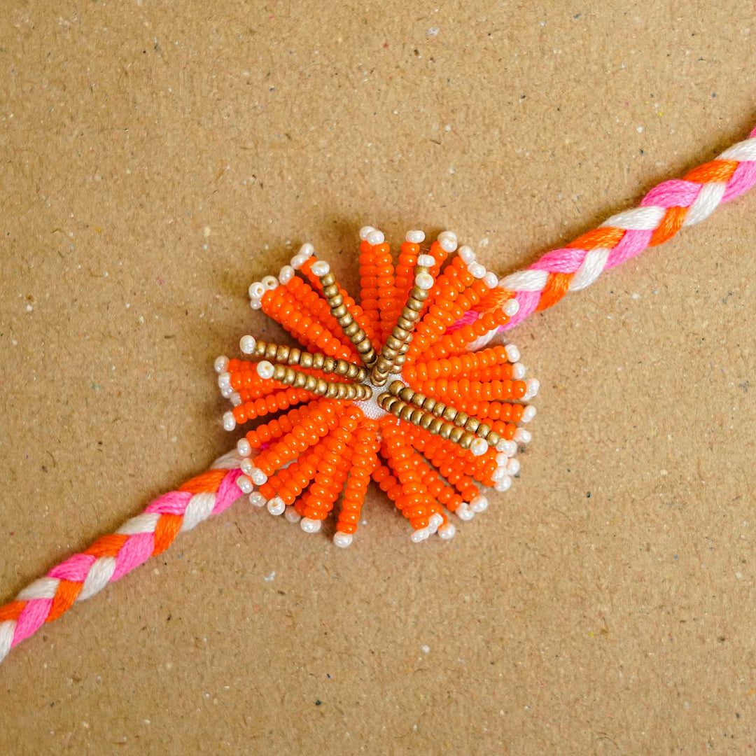 Reusable Beaded Orange Flower Rakhi With Roli Chawal