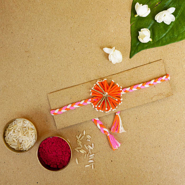 Reusable Beaded Orange Flower Rakhi With Roli Chawal