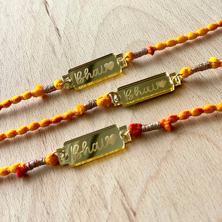 Handcrafted Golden Acrylic Rakhi With Roli Chawal