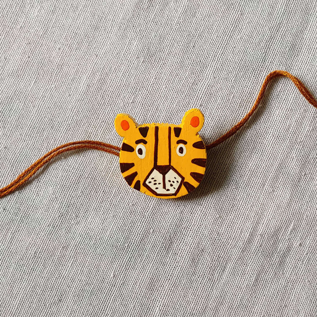 Handpainted Quirky Wooden Rakhi With Roli Chawal