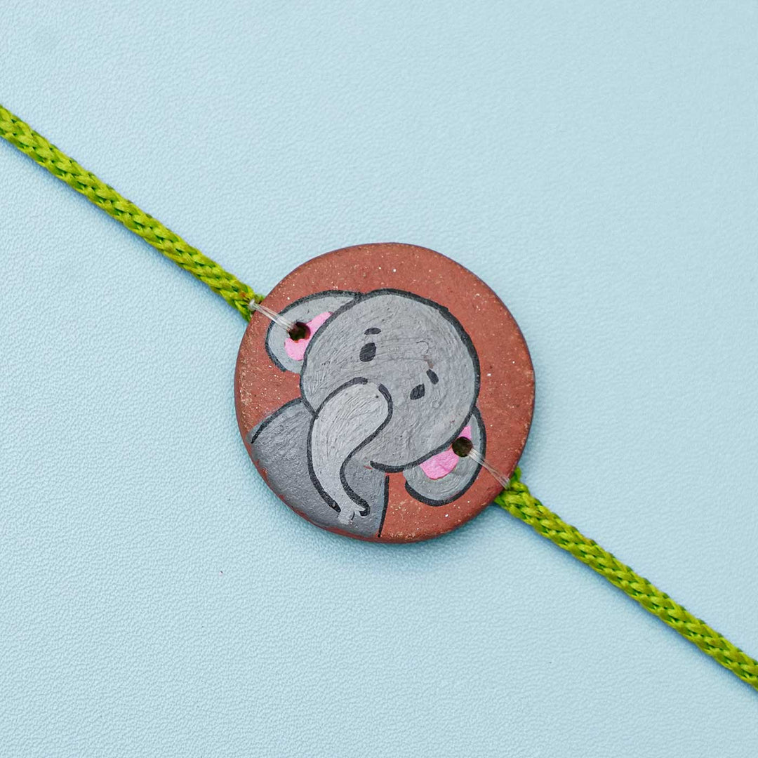 Hand-painted Grey Elephant Terracotta Rakhi With Roli Chawal for Kids