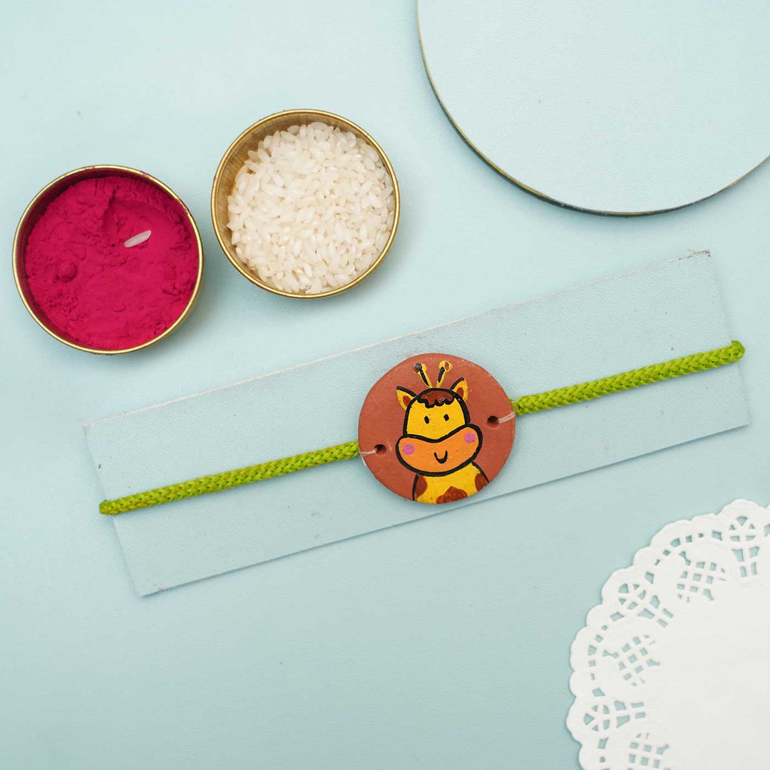 Hand-painted Giraffe Face Terracotta Rakhi With Roli Chawal for Kids