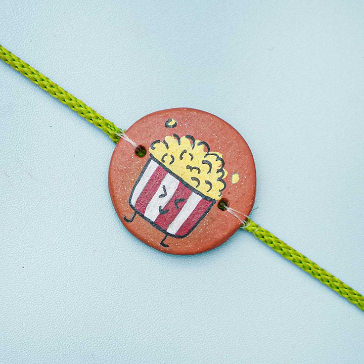 Hand-painted Popcorn Terracotta Rakhi With Roli Chawal