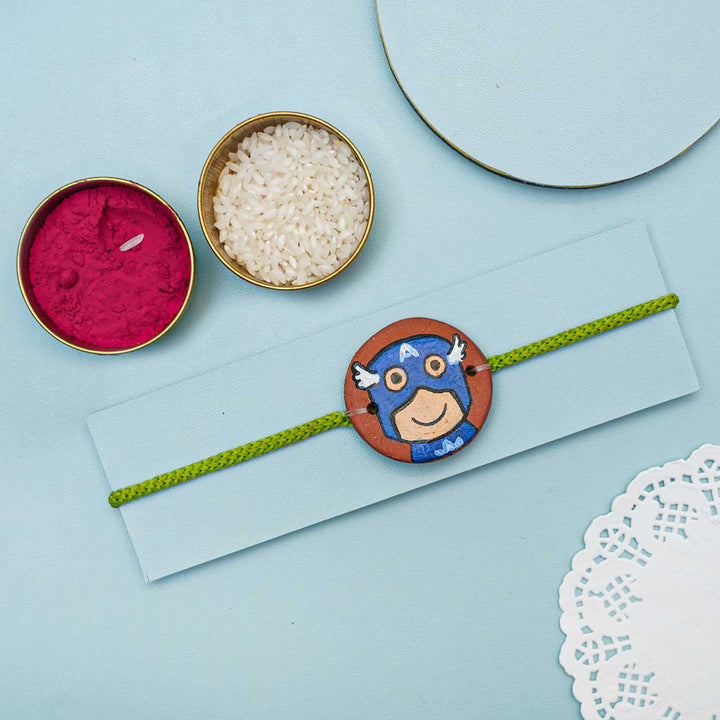 Hand-painted Captain America Terracotta Rakhi With Roli Chawal for Kids