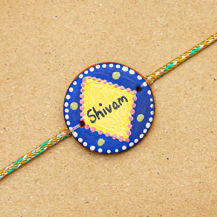 Personalized Terracotta Dark Blue & Yellow Rakhi With Roli Chawal