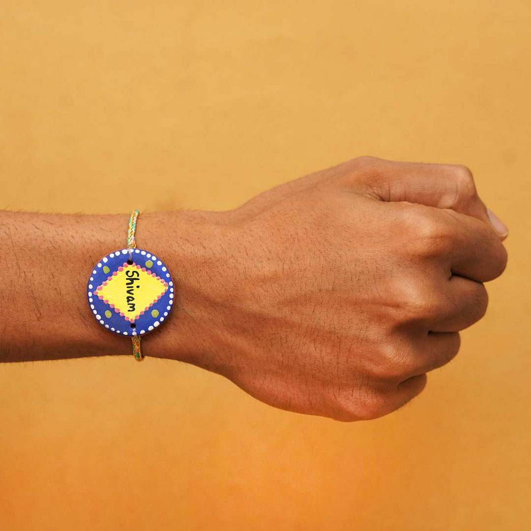 Personalized Terracotta Dark Blue & Yellow Rakhi With Roli Chawal