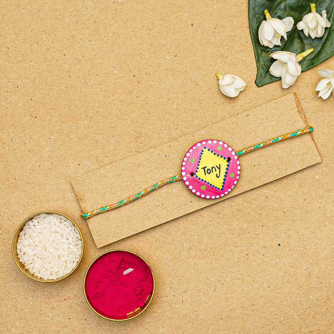 Personalized Terracotta Pink & Yellow Rakhi With Roli Chawal