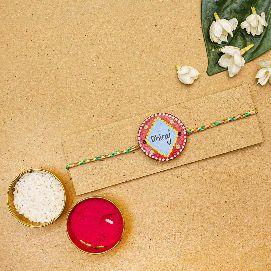 Personalized Terracotta Red & Blue Rakhi With Roli Chawal