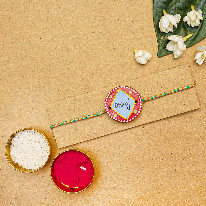 Personalized Terracotta Red & Blue Rakhi With Roli Chawal