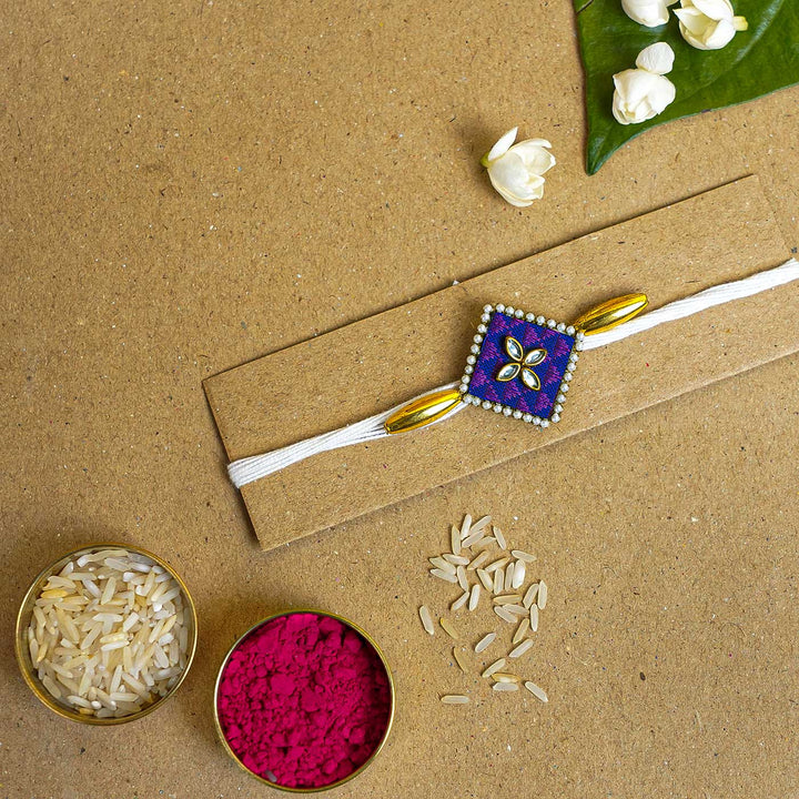 Handmade Purple Diamond Fabric & MDF Rakhi With Roli Chawal