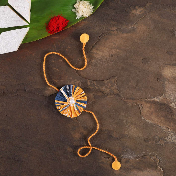 Handmade Ecofriendly Yellow Recycled Paper Rakhi With Roli Chawal