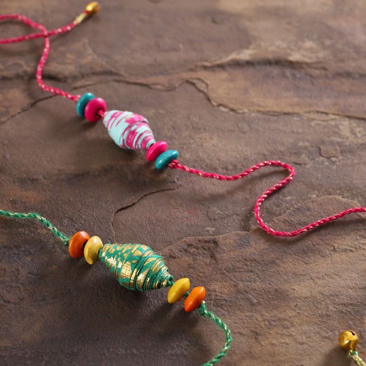 Handmade Beaded Paper Tubular Rakhi With Roli Chawal | Set of 2