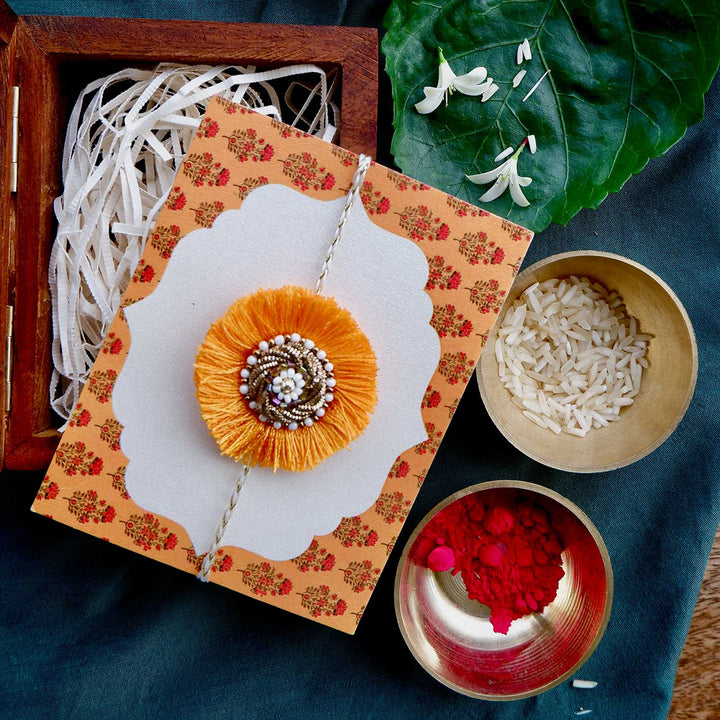 Handmade Zardozi Mustard & White Bead Work Rakhi With Wooden Box & Roli Chawal