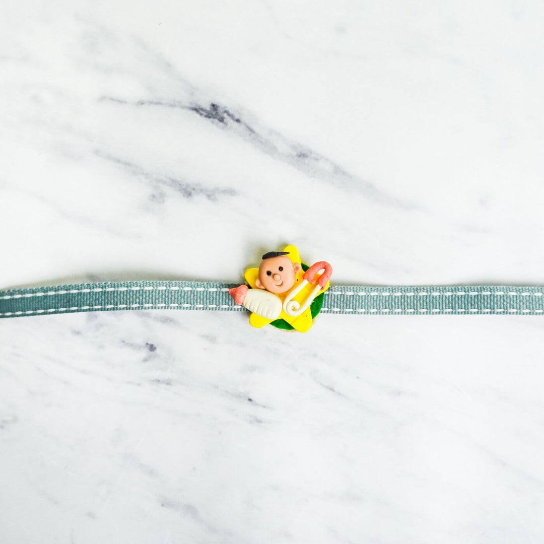 Handmade Porcelain Clay Themed Rakhi With Roli Chawal