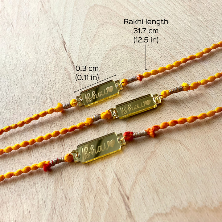 Handcrafted Golden Acrylic Rakhi With Roli Chawal