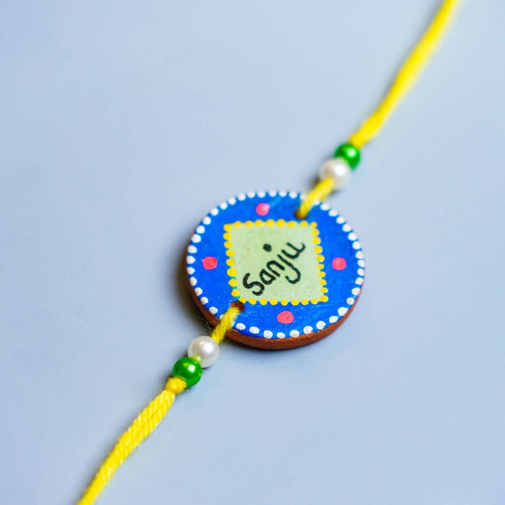 Personalized Terracotta Blue & Green Rakhi With Roli Chawal