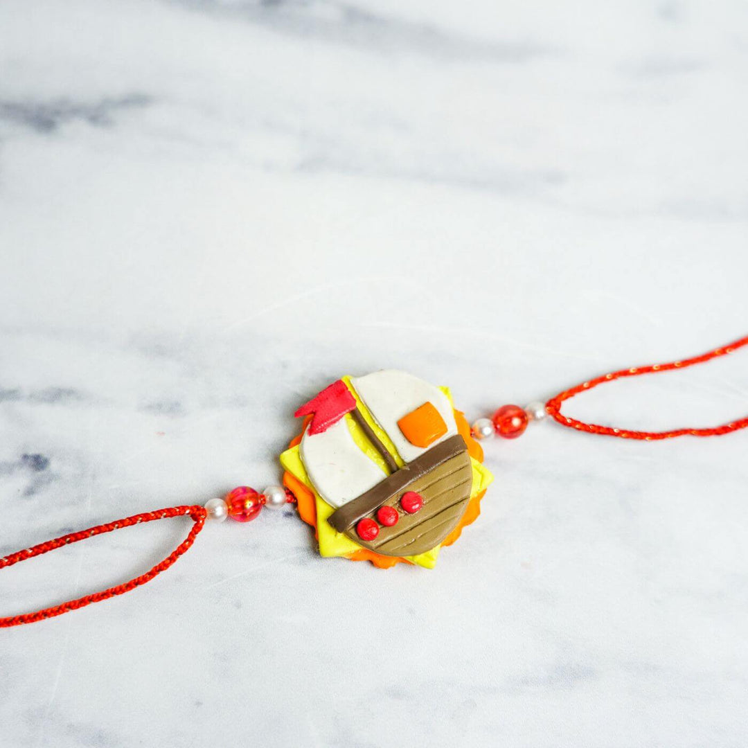 Handmade Porcelain Clay Themed Rakhi With Roli Chawal