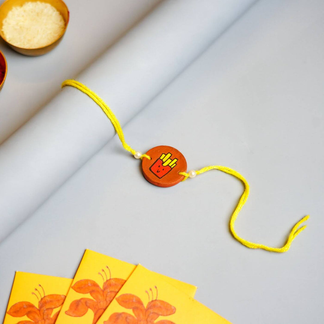 Hand-painted French Fries Terracotta Rakhi With Roli Chawal