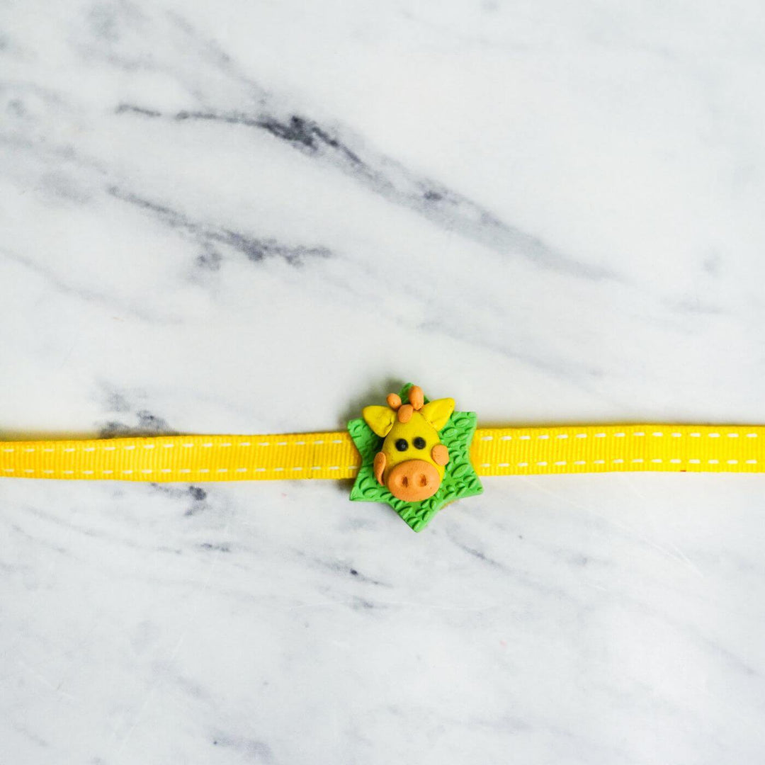 Handmade Porcelain Clay Themed Rakhi With Roli Chawal