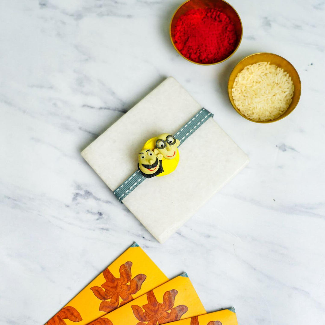 Handmade Porcelain Clay Themed Rakhi With Roli Chawal