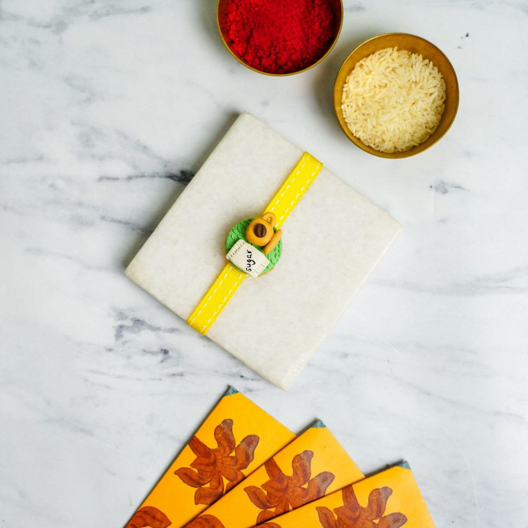 Handmade Porcelain Clay Themed Rakhi With Roli Chawal