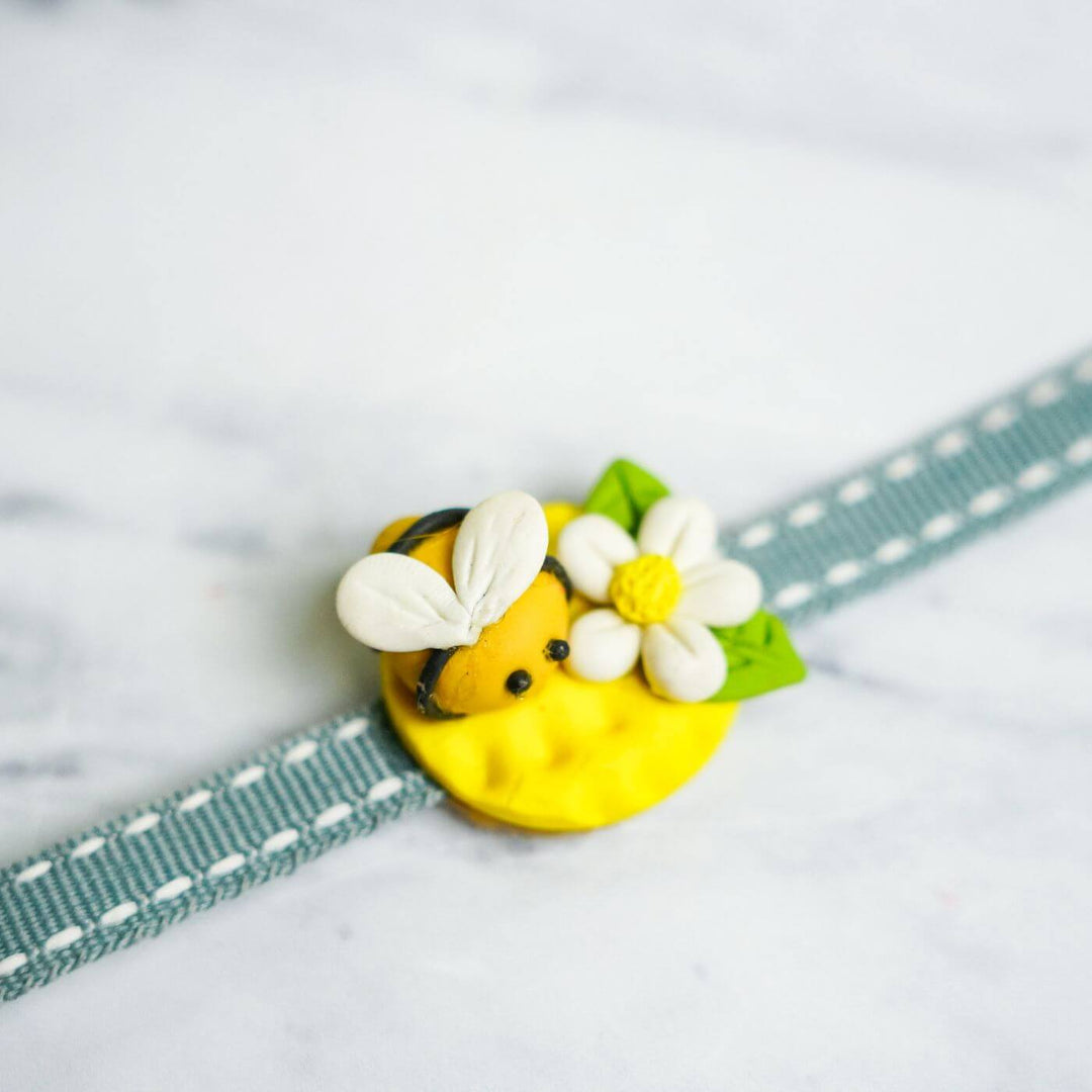 Handmade Porcelain Clay Themed Rakhi With Roli Chawal