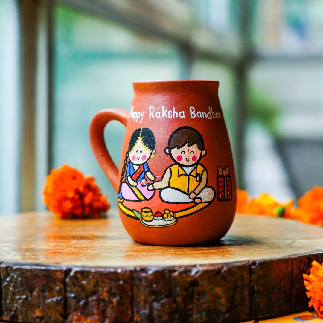 Handpainted Terracotta Rakhi & Mug Set with Roli Chawal
