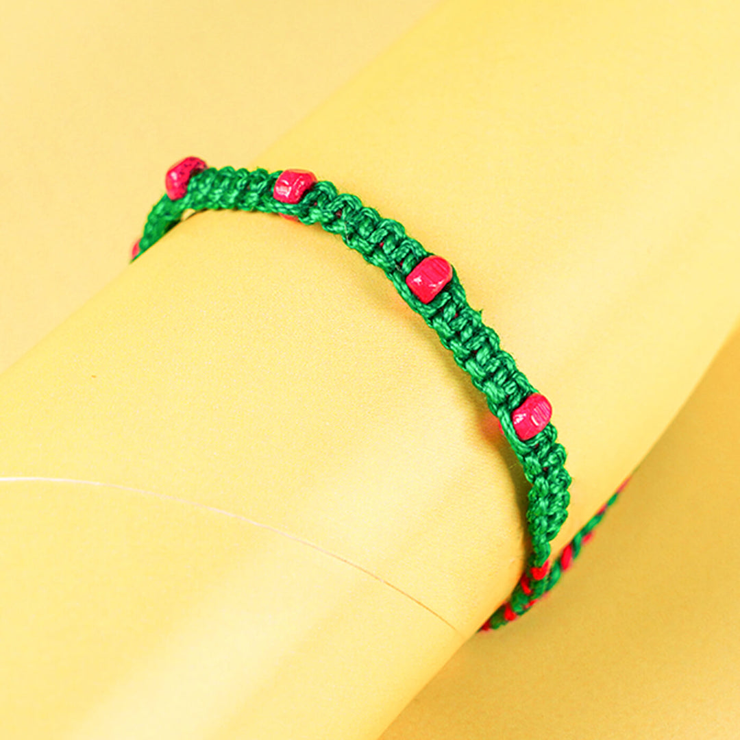 Green Macramé Cotton Rakhi With Pink Beads